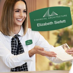 Desk clerk with a custom shaped bulged rectangle name tag.