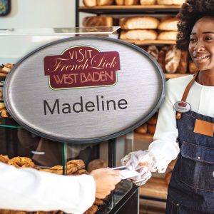 Bakery assistant with a logo Mighty Badge.