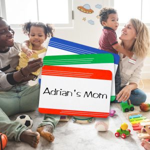 Daycare workers with children and adhesive name badges in mulitple colors.