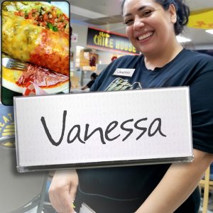 Restaurant server with a clear reusable name badge. 